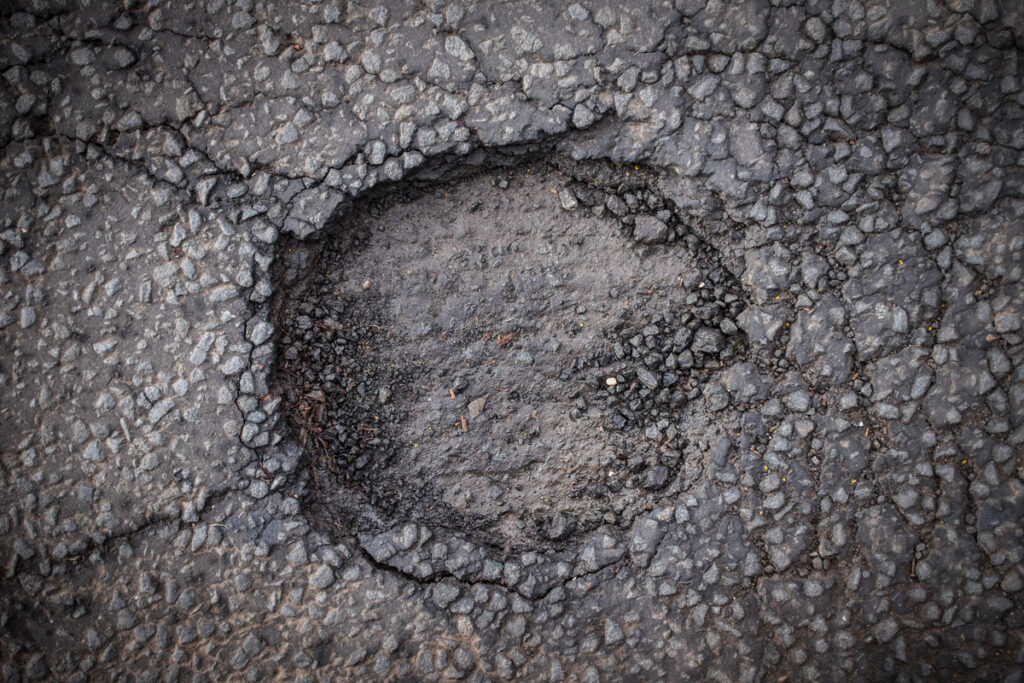 a large pothole in a road