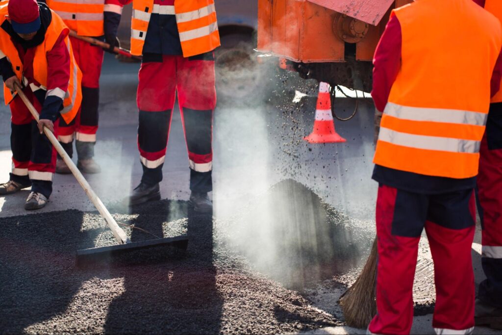 Construction workers working with concrete. 